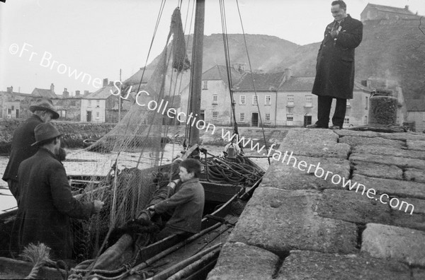 FR.JOE REA SPEAKING TO FISHERMAN